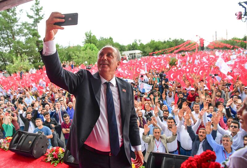 Muharrem Ince, presidential candidate of Turkey's main opposition Republican People's Party, takes a pictures as he addresses an election rally in Diyarbakir, Turkey, Monday, June 11, 2018. Ince is seen as a strong contender to end Turkey's President Recep Tayyip Erdogan's rule in presidential elections on June 24.(CHP Press Service via AP, Pool)