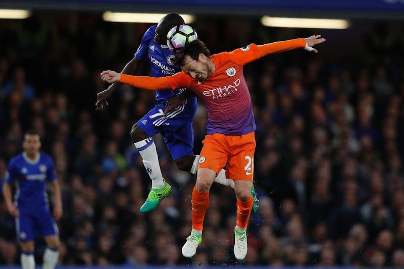 Manchester City’s David Silva vie for possession with Chelsea’s N’Golo Kante during their match in London on April 5, 2017. Adrian Dennis / AFP