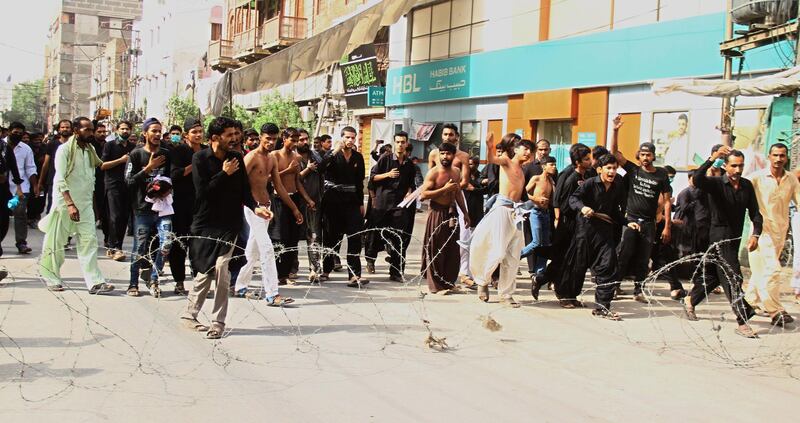 Pakistani Shi'ite Muslims beat themselves as they gather to observe the Martyr Day of Hazrat Ali, cousin of Prophet Muhammad, on the 21st day of Ramadan, despite the lockdown, in Hyderabad, Pakistan. EPA