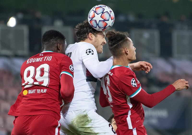 FC Midtjyllands Erik Sviatchenko, center, in action with Liverpool's Billy Koumetio, left, and Rhys Williams during their Champions League Group D soccer match at MCH Arena in Herning, Denmark, Wednesday Dec. 9, 2020. (Bo Amstrup/Scanpix via AP)