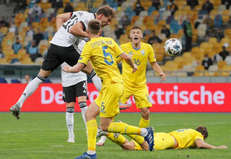 Germany's Leon Goretzka wins a header in front of Ukraine's Serhiy Sydorchuk. EPA