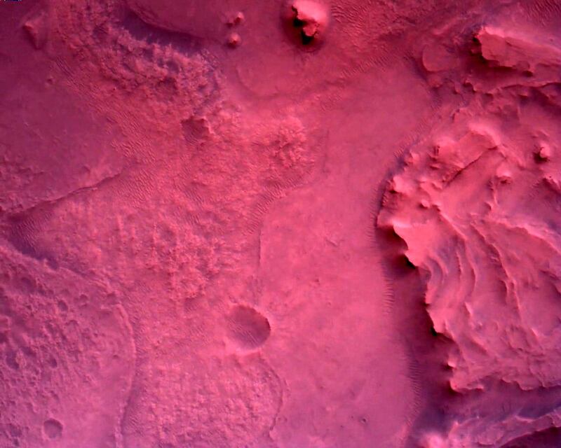 The surface of Mars directly below Nasa's Mars Perseverance rover, seen using rover's down-look camera. Nasa / JPL-Caltech / Reuters
