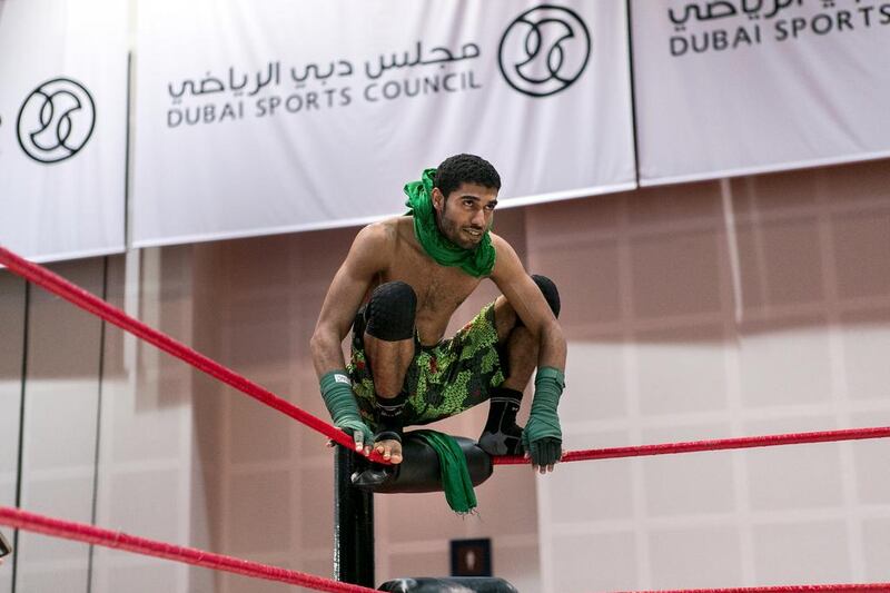 Emirati wrestler Cryptid, real name Hammad Mohammed, shown on top of the turnbuckle at a Dubai Pro Wrestling show. Reem Mohammed / The National