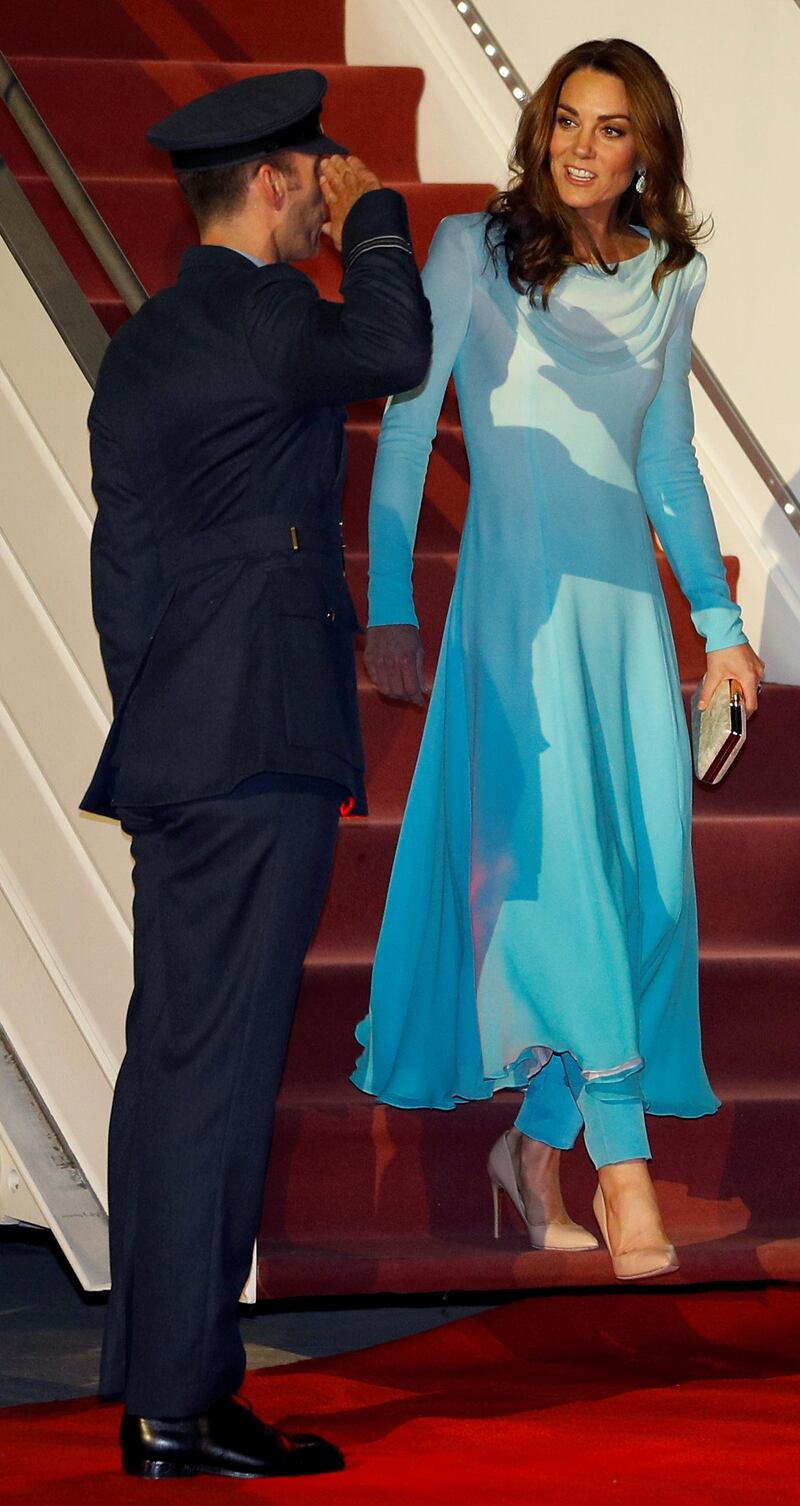 The royal chose a shalwar kameez to arrive in Pakistan. The design is by British label, Catherine Walker. Reuters