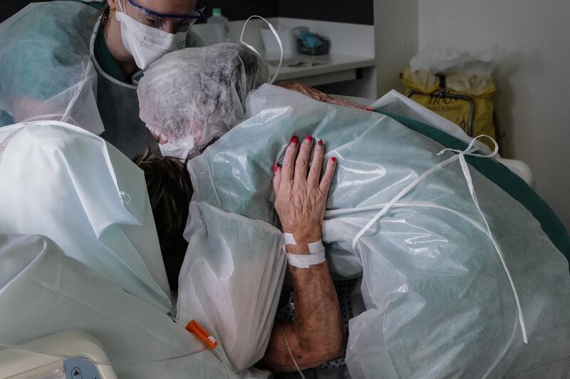 Nurses lift a Covid-19 patient at the Pasteur hospital resuscitation unit in Colmar, eastern France. AFP