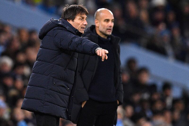 Tottenham coach Antonio Conte and Manchester City's  Pep Guardiola watch the action. AFP