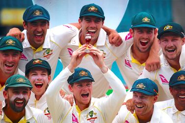 Then Australia captain Steve Smith holds a replica of the Ashes urn with his teammates after winning the series 4-0 in 2017. Reuters