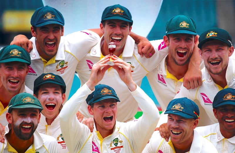 Cricket - Ashes test match - Australia v England - SCG, Sydney, Australia, January 8, 2018. Australia's captain Steve Smith holds a replica Ashes urn next to team mates after they won the fifth Ashes cricket test match and the series 4-0.    REUTERS/David Gray