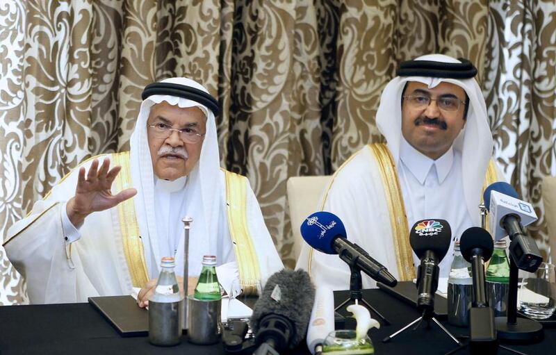 Saudi minister of oil and mineral resources Ali Al Naimi, left, and Qatari minister of energy and industry Mohammed Saleh Al Sada at a press conference in Doha, in February. EPA
