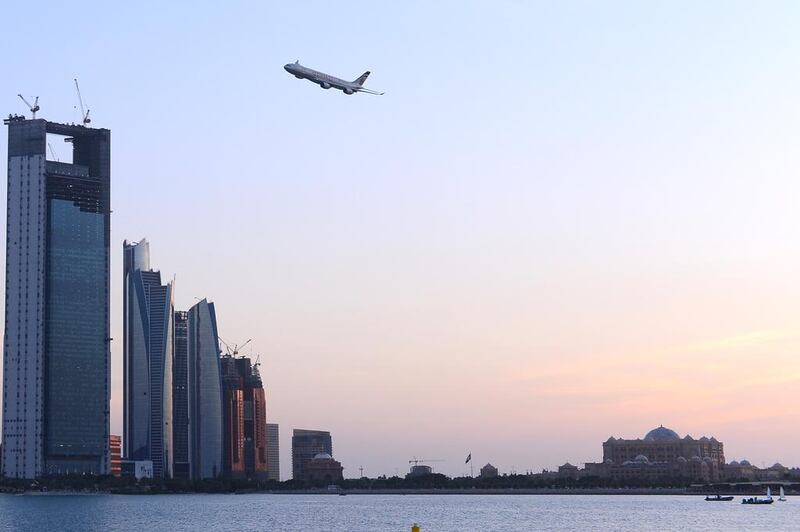 Etihad aircraft flying over the Abu Dhabi corniche in Abu Dhabi. Courtesy Etihad Airways