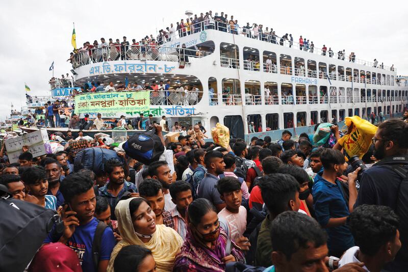 Passengers jostle for a seat on a ferry as they leave Dhaka to celebrate Eid with their families. Reuters