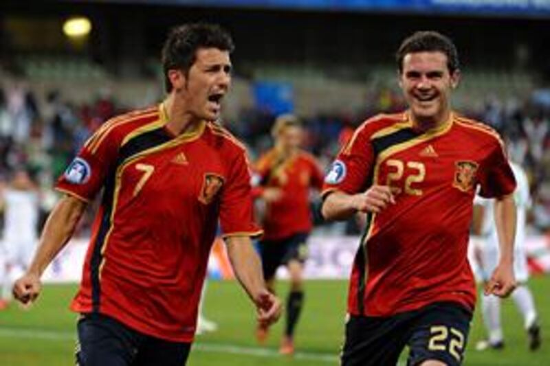 David Villa, left, has moved into second place in Spain's list of all-time goalscorers after his effort against Iraq in Bloemfontein.