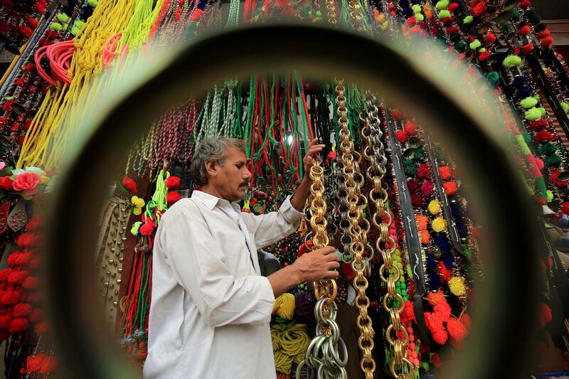 Ornaments for sacrificial animals on sale at a roadside stall in Peshawar, Pakistan, before the Muslim festival of Eid Al Adha. EPA