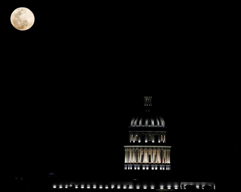 A view of the super moon over the dome of the National Capitol Building, in Havana, Cuba.  EPA