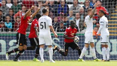 Football Soccer -  Premier League - Swansea City vs Manchester United - Swansea, Britain - August 19, 2017   Manchester United's Eric Bailly celebrates scoring their first goal with Romelu Lukaku and Nemanja Matic    Action Images via Reuters/Andrew Boyers     EDITORIAL USE ONLY. No use with unauthorized audio, video, data, fixture lists, club/league logos or "live" services. Online in-match use limited to 45 images, no video emulation. No use in betting, games or single club/league/player publications. Please contact your account representative for further details.