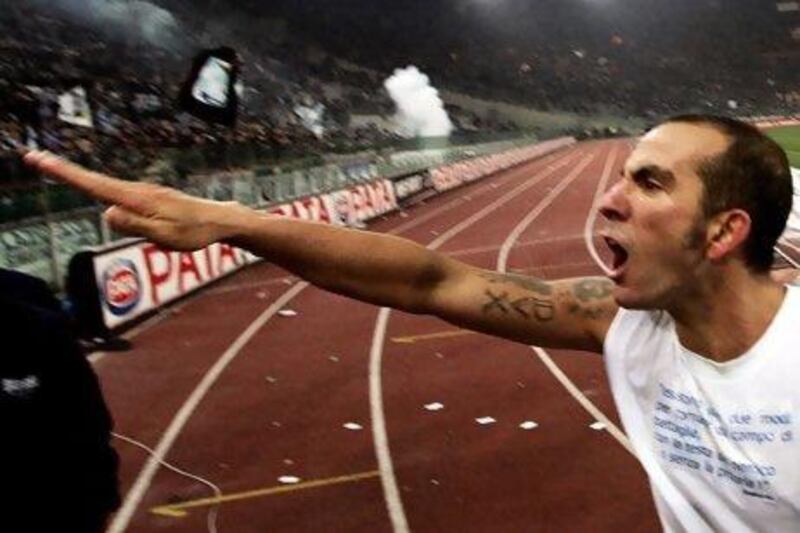 Paolo Di Canio using the "Roman salute" at the end of the Italian Serie A match between Lazio and city rivals Roma at Olympic stadium in Rome in 2005. Filippo Monteforte / EPA