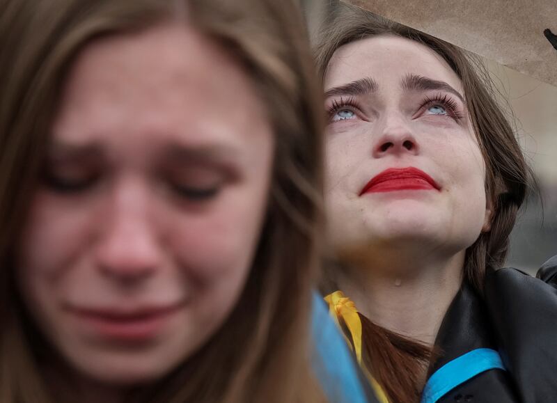 Women cry as they take part in a rally demanding international leaders organise a humanitarian corridor for the evacuation of Mariupol, the besieged Ukrainian city where thousands are trapped. Reuters