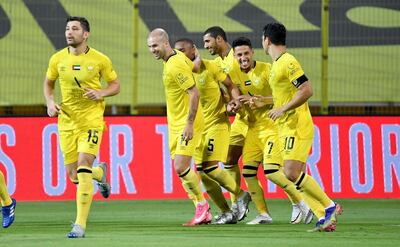 Al Wasl players celebrate during their 3-0 victory over Al Fujairah on Thursday in Dubai. UAE Pro League