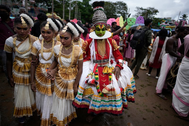 Children, dressed in classical dance costumes, participate in the Athachamayam procession marking the beginning of Onam festival in Kochi, southern Kerala state, India, Tuesday, Aug.  30, 2022.  (AP Photo / R S Iyer)