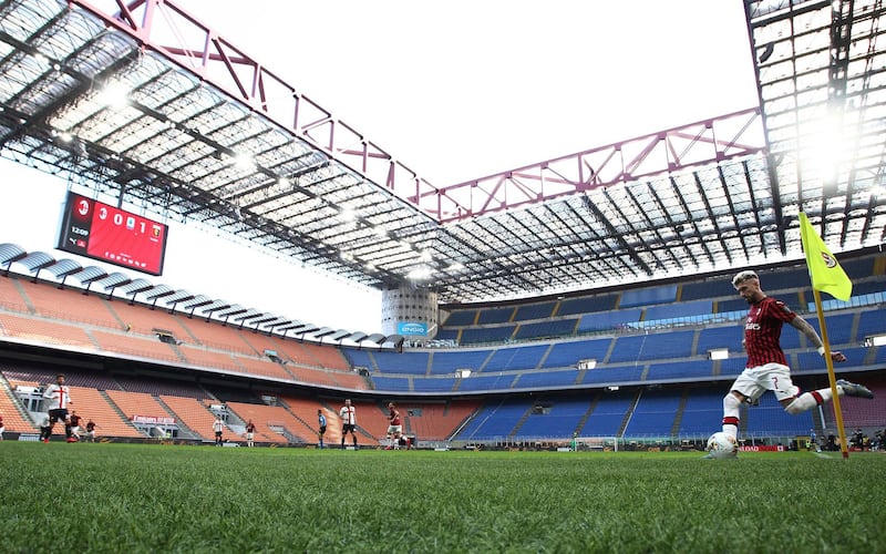 AC Milan's Samu Castillejo takes a corner in an empty San Siro Stadium during the Serie A match against Genoa, which was played behind closed doors due to the coronavirus outbreak in Italy. AP