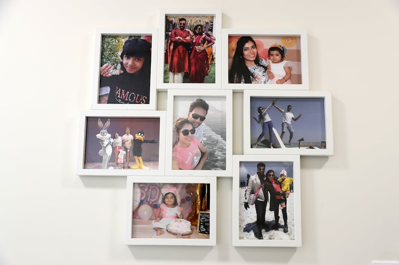 Family photos are displayed throughout the home