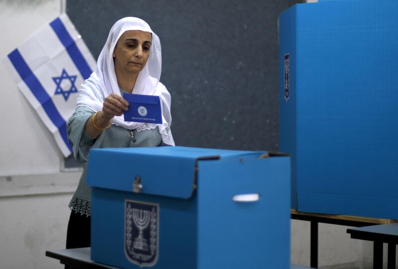 An Israeli Arab woman casts her vote in Daliyat Al Karmel. AFP