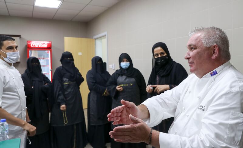 Australian Master Chef Richard Green speaks with mothers attending the first cooking course organised by Zayed Higher Organisation for People of Determination.