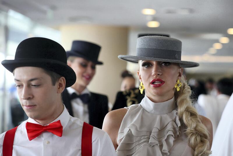 Dubai, United Arab Emirates - March 30, 2019: A visitor to Meydan enjoys the Dubai World Cup. Saturday the 30th of March 2019 at Meydan Racecourse, Dubai. Chris Whiteoak / The National