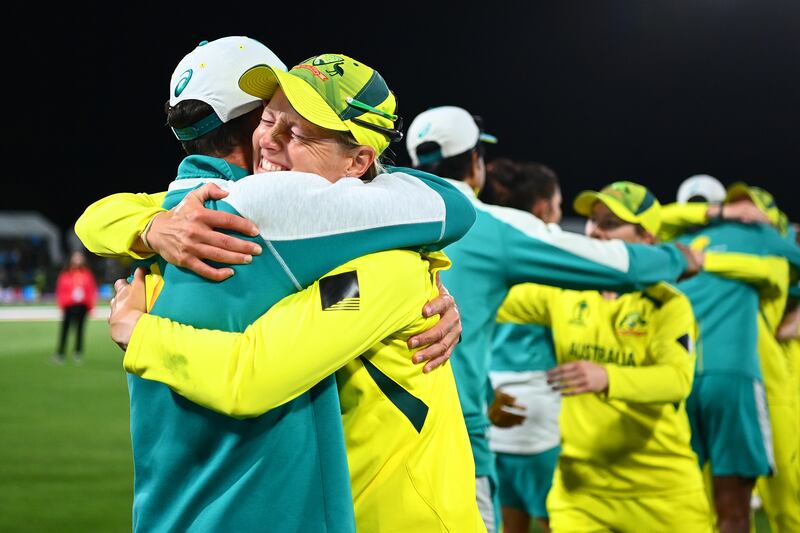 Australia captain Meg Lanning celebrates with coaching staff after their victory over England in the 2022 Women's Cricket World Cup final. Getty