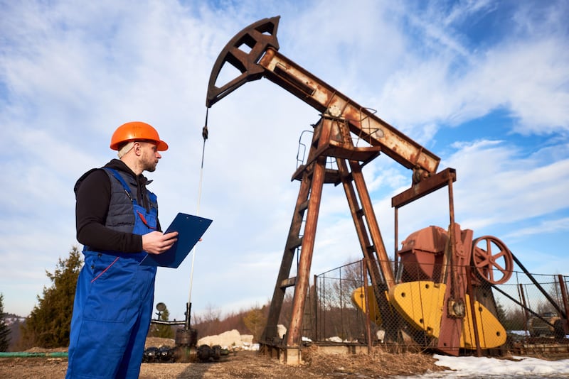 A petroleum engineer checks an oil-pumping unit. Jobs in demand in the UAE’s oil and gas industry include those for the roles of project managers, senior reservoir engineers, senior drilling engineers, senior process engineers and senior maintenance engineers. Alamy