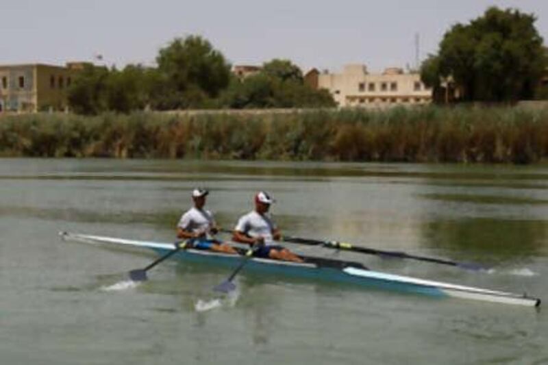 Iraqi rowing athletes Hamza Hussein (left) and Haider Nawzad, who have qualified for the Beijing Olympics, row in Tigris river in Baghdad, as they continue their training despite the decision of the International Olympic Committee to  suspend the membership of the Iraqi Olympic Committee.