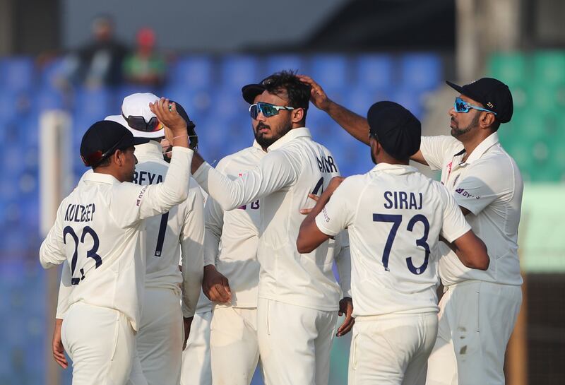 India's Axar Patel, centre, celebrates the wicket of Bangladesh's Mushfiqur Rahim in the first Test. AP