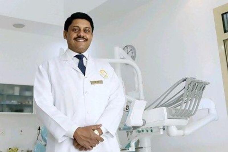Dr Joy Antony says opening his third dental practice in Jumeirah was a difficult decision after the economic downturn. Jeffrey E Biteng / The National