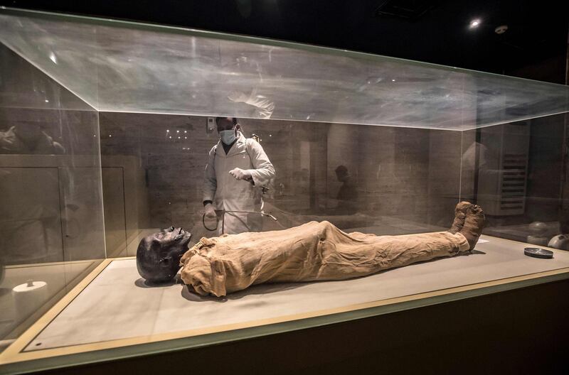 A worker disinfects the Royal Mummies Hall at the Egyptian Museum in Cairo's landmark Tahrir Square.   AFP