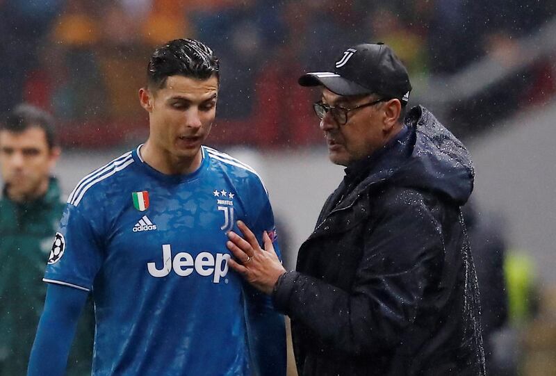 Juventus star Cristiano Ronaldo listens to coach Maurizio Sarri after he is substituted for Paulo Dybala. Reuters