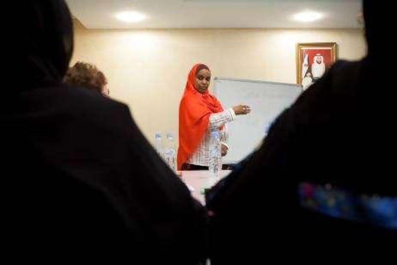 Abu Dhabi, UAE, September 14, 2010: 
Salma El Khidir, the SLO School's liaison officer, goes over basic skills teachers should be aware of as they head into the school year. 

The Director General of Adec, Dr. Mugheer Al Khaili announced yesterday his plans to have every student in the UAE fluent in English and Arabic by the time they graduate in order to better equip the country's future leaders. 

Lee Hoagland / The National