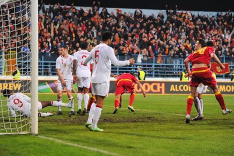 Montenegro players celebrate after Dejan Damjanovic's equaliser against England.