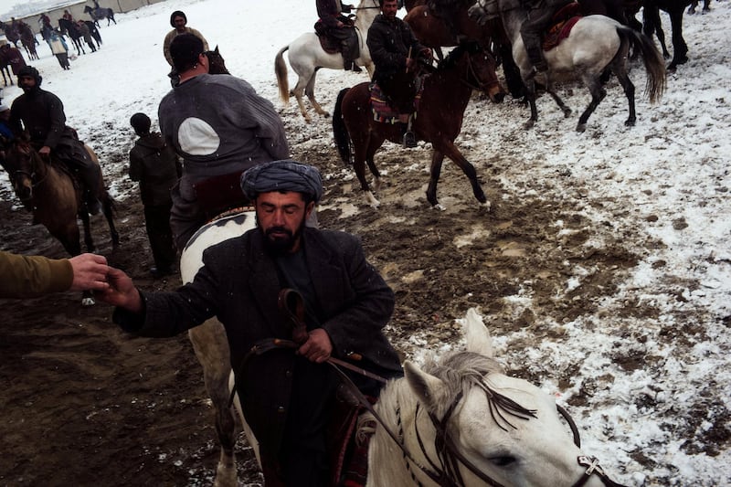 January 11, 2019 - Kabul, Kabul, Afghanistan: 

Bozkashi is a sport with roots to nomadic tribes in Central Asia. The game involves teams of horsemen fighting for the carcass of a calf or a goat and placing it within the goal area.

Bozkashi was banned in Afghanistan during the Taliban regime. It was considered "unislamic" by the fundamentalist group. The sport has seen a resurgence since the fall of the Taliban in 2001. The recent rise of the Taliban may threaten it existence as the group moves to normalize its image as a political party.
(Ivan Flores/Polaris)
