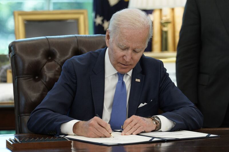 US President Joe Biden signs the Ukraine Democracy Defence Lend-Lease Act of 2022 in the Oval Office of the White House. Bloomberg