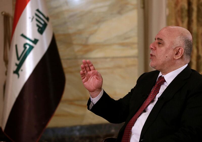 Iraq's Prime Minister Haider al-Abadi speaks during an interview with The Associated Press in Baghdad, Iraq, Saturday, Sept. 16, 2017. Al-Abadi says he is prepared to intervene militarily if the Kurdish region's planned referendum results in violence. (AP Photo/Khalid Mohammed)
