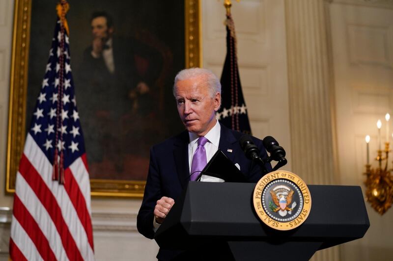 President Joe Biden leaves after delivering remarks on COVID-19, in the State Dining Room of the White House, Tuesday, Jan. 26, 2021, in Washington. (AP Photo/Evan Vucci)