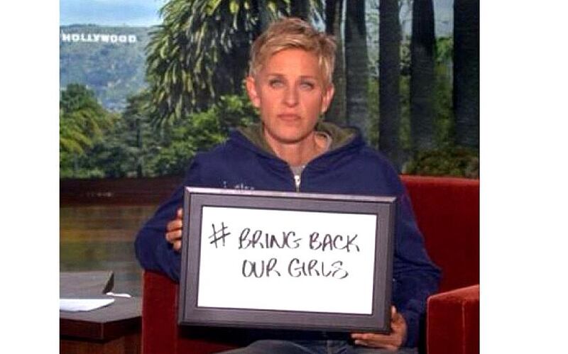 Ellen DeGeneres shows support by holding up a #BringBackOurGirls sign on her show. Courtesy The Ellen DeGeneres Show