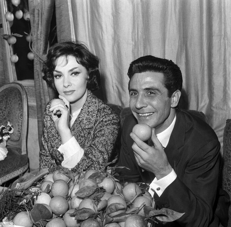 Lollobrigida and French singer Gilbert Becaud received the Prix Orange prize, awarded by a jury of journalists to the artists most co-operative with the press in 1959. AFP