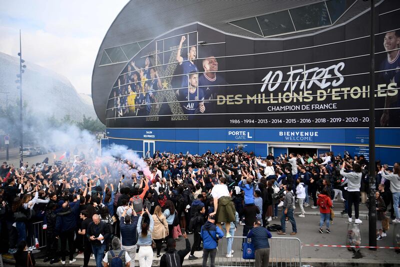 Kylian Mbappe is cheered by supporters outside the Parc des Princes. AFP