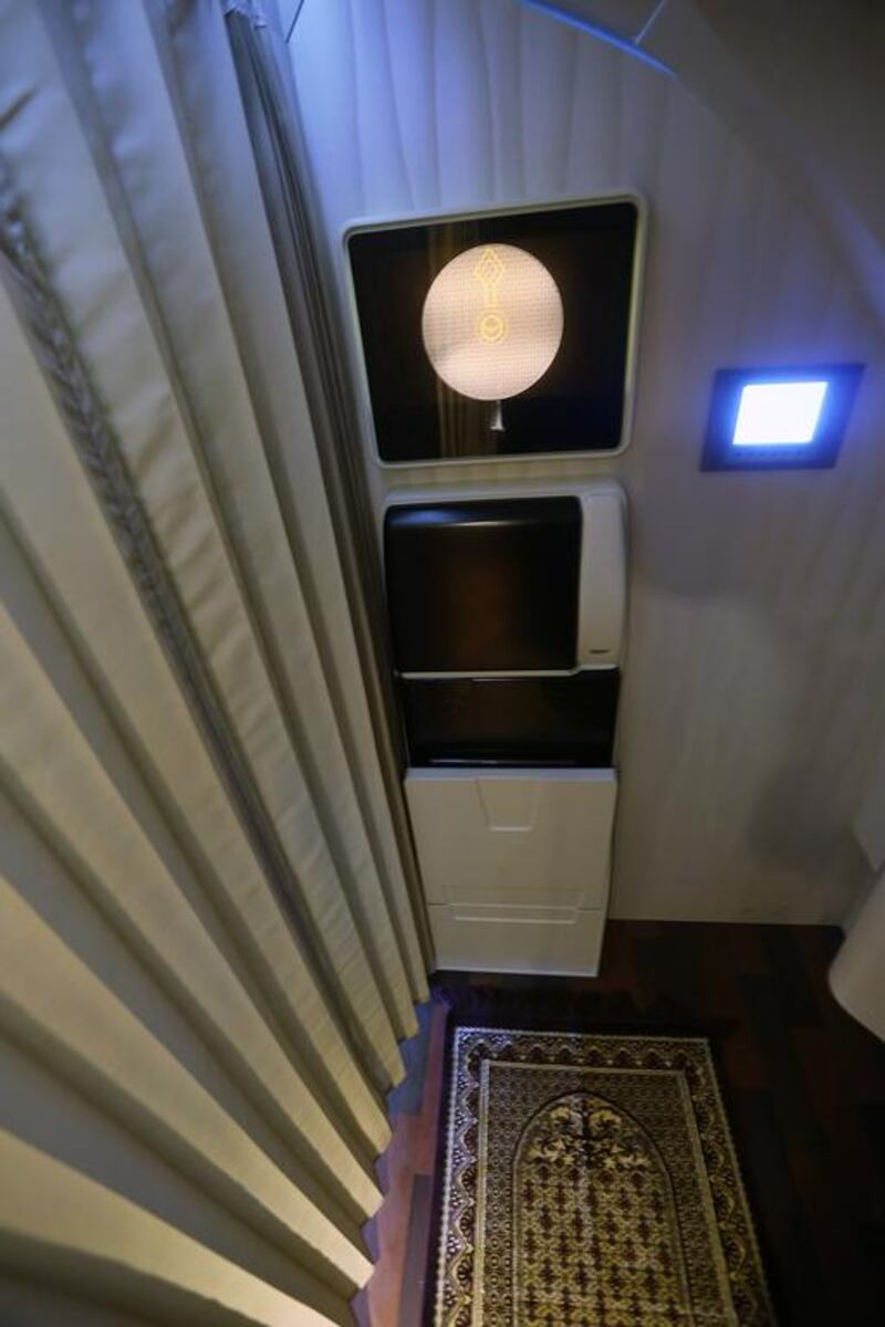 A dedicated prayer area with a prayer rug and prayer clock, which will be a common feature on Etihad's upcoming Airbus 380 and Boeing 787 Dreamliner fleet. Delores Johnson / The National