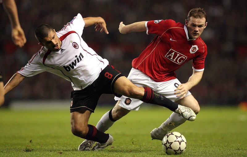 Manchester United's British forward Wayne Rooney (R) is tackled by AC Milan's Gennaro Gattuso during their European Champions League semi final first leg football match at Old Trafford in Manchester, north west England, 24 April 2007. AFP PHOTO/FILIPPO MONTEFORTE (Photo by FILIPPO MONTEFORTE / AFP)