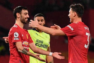 Manchester United's Bruno Fernandes celebrates with Nemanja Matic after scoring the third goal in the 3-1 win against Newcastle. EPA