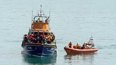 A group thought to be migrants are brought in to Dover, Kent, on a lifeboat after the small boat in which they were travelling was intercepted in the Channel on Wednesday. PA