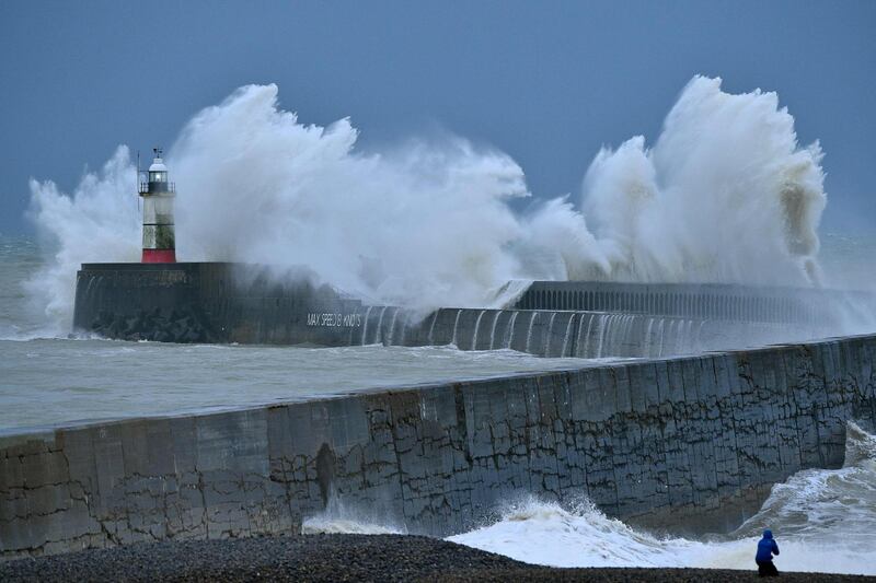 Waves crash over Newhaven Lighthouse and the harbour wall on the south coast of England as Storm bella brings rain and high winds to the UK. AFP
