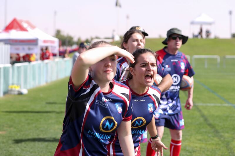 Players from the Abu Dhabi French A team cheer on their teammates during the HSBC Rugby Festival 2022 at The Sevens Stadium in Dubai. 